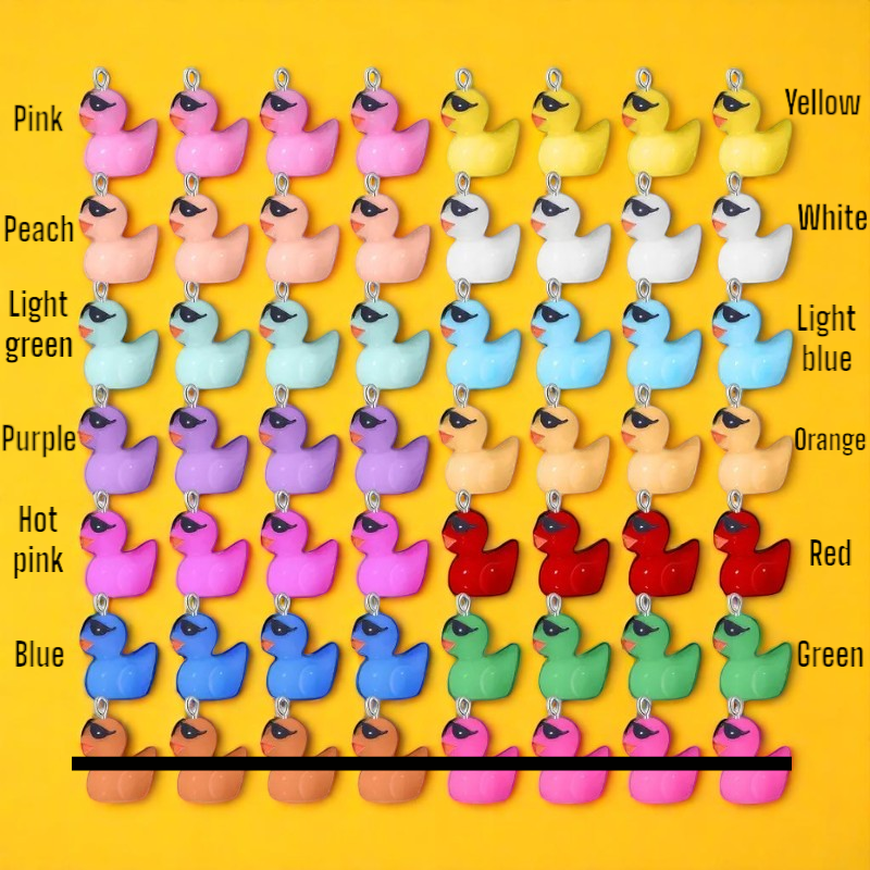 Color chart with small duck-shaped charms in various colors on a yellow background