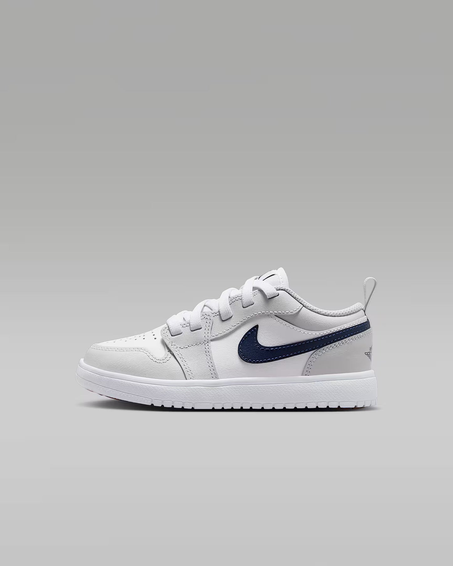 White sneaker with a blue logo on a gray background