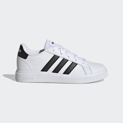White sneaker with black stripes on a light gray background