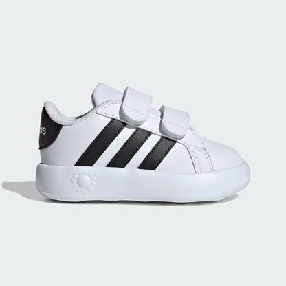 White sneaker with black stripes on a light gray background