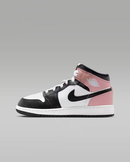 Black, white, and pink sneaker on a gray background
