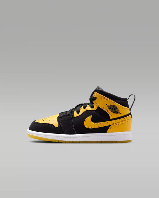 Black and yellow sneaker on a gray background