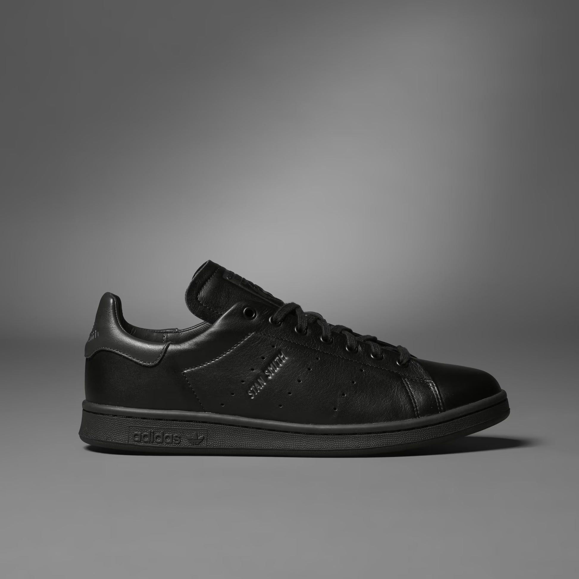 Black sneaker on a gray background