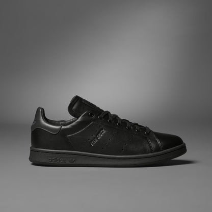 Black sneaker on a gray background