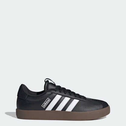 Black sneaker with white stripes on a light gray background