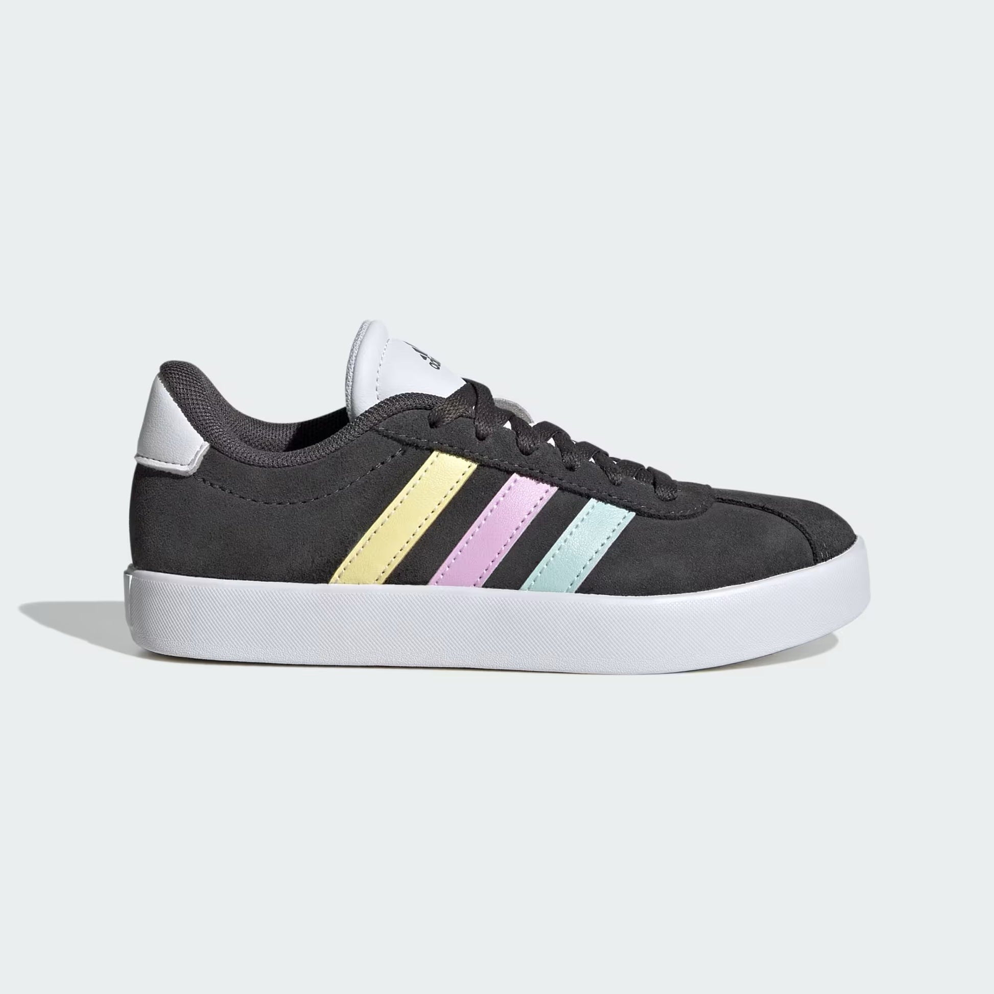 Black sneaker with pastel striped accents on a light gray background