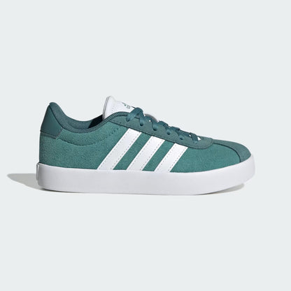 Green sneaker with white stripes on a light gray background