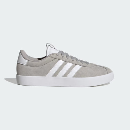 Gray sneaker with white stripes on a light gray background