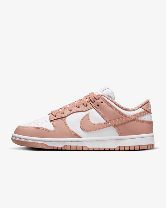 A pair of rose and white sneakers 