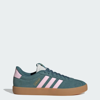 Green sneaker with pink stripes on a white background